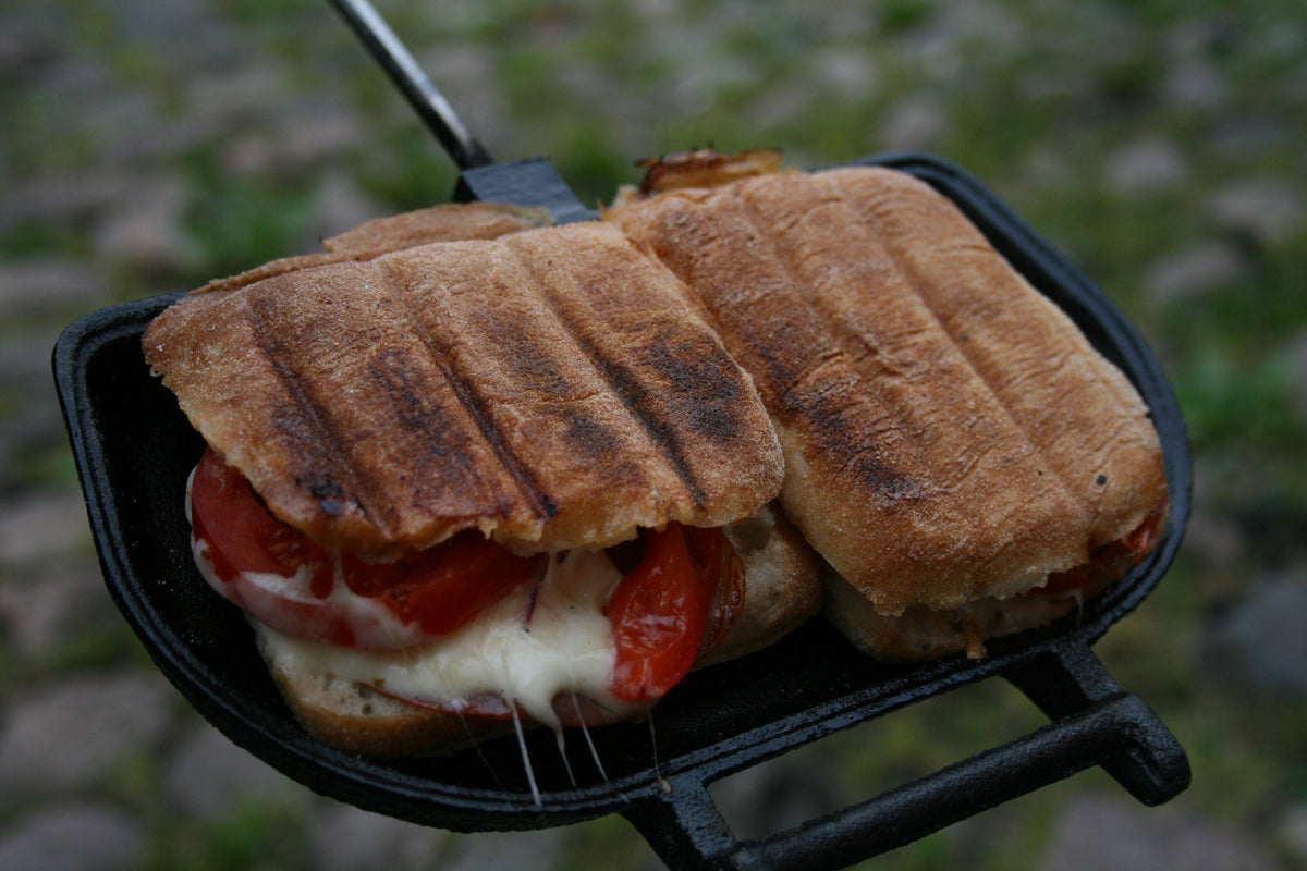 Panini Press in use with cooked sandwiches close up