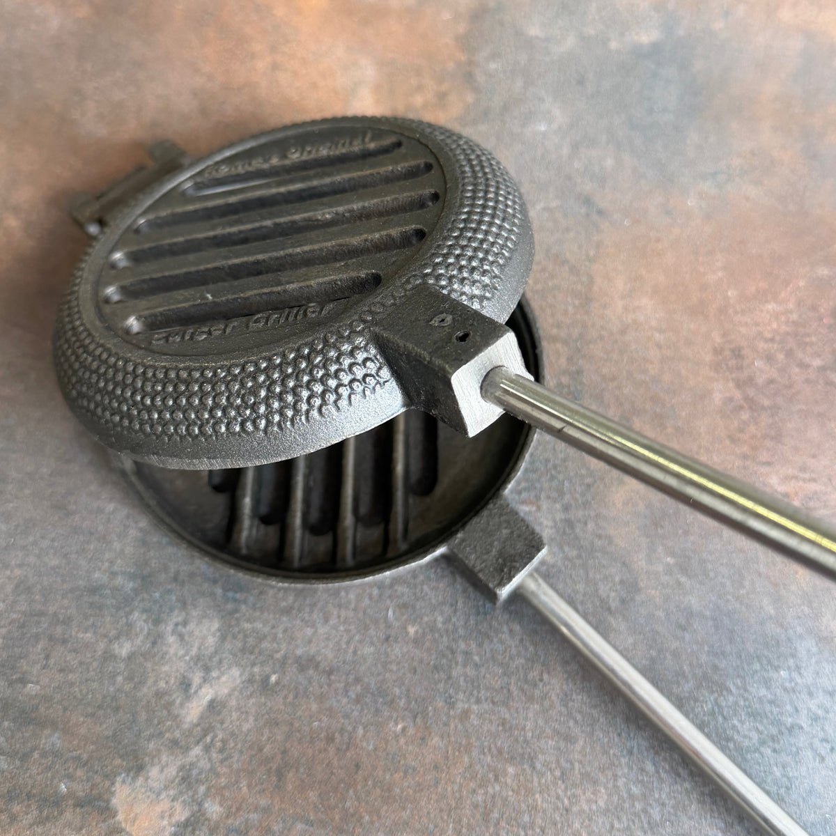 Wilderness Hamburger Griller close up gray background