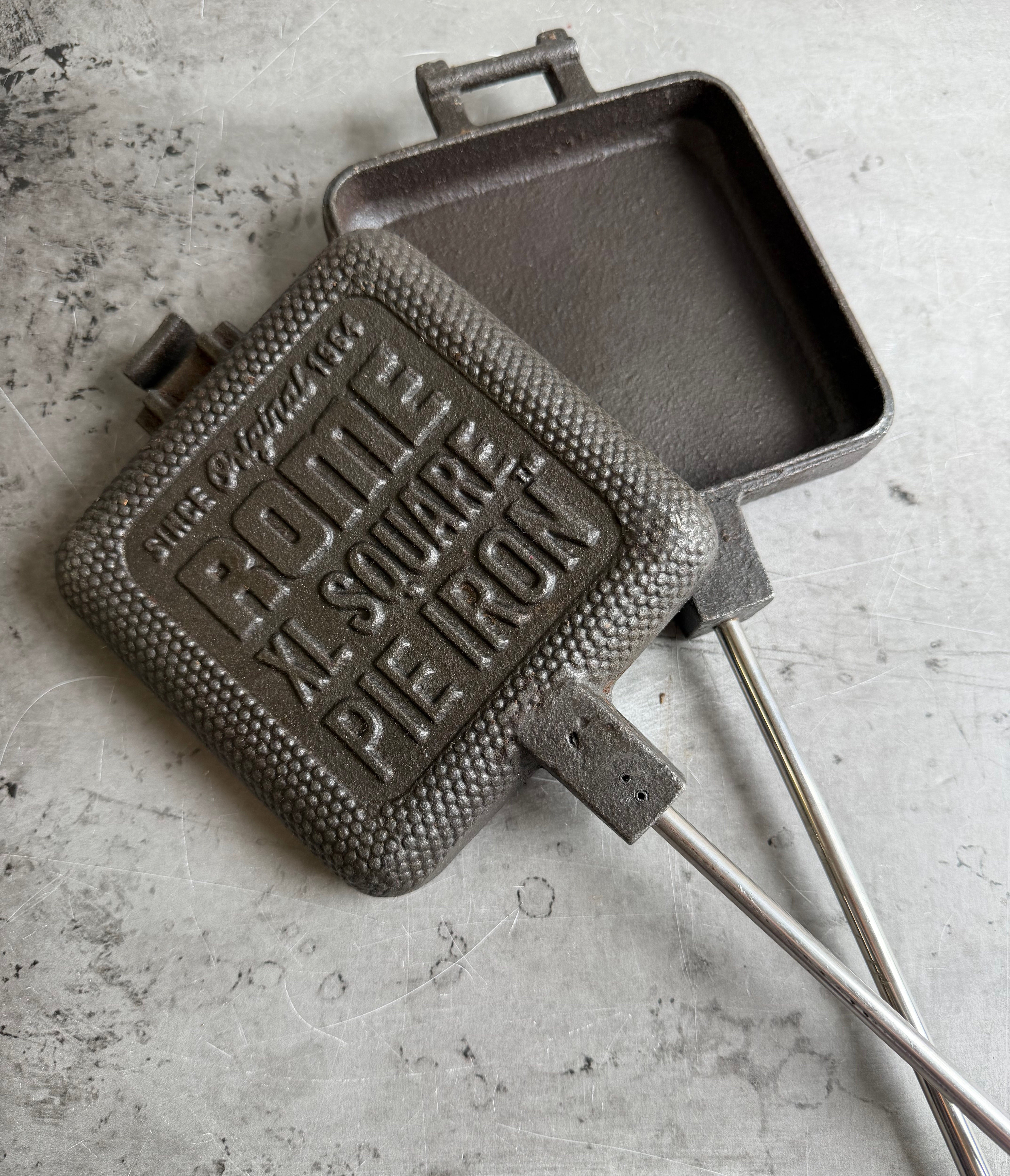 XL Square Pie Iron unhinged close up view gray background