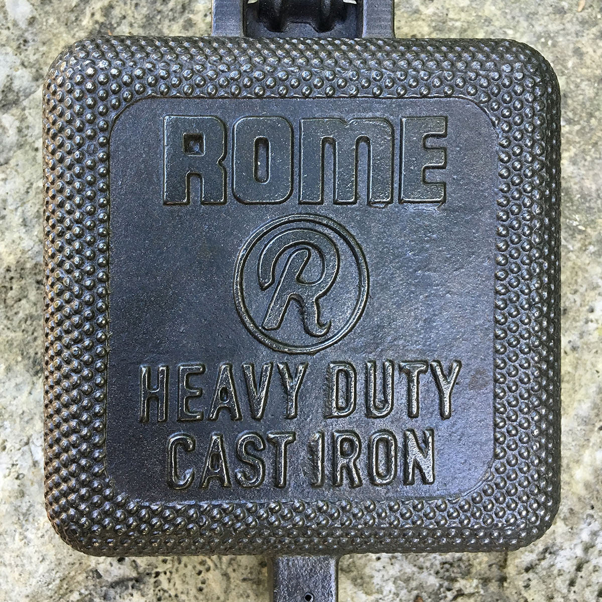 XL Square Pie Iron cooking head close up gray background