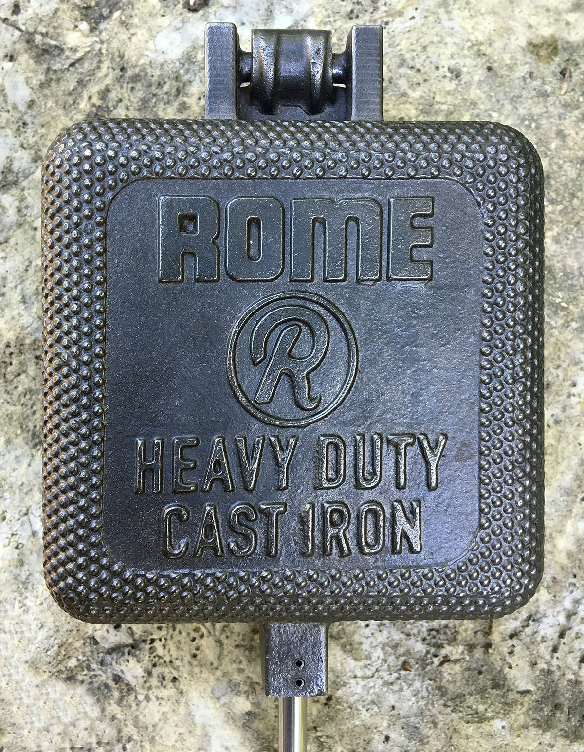 XL Square Pie Iron cooking head close up gray background