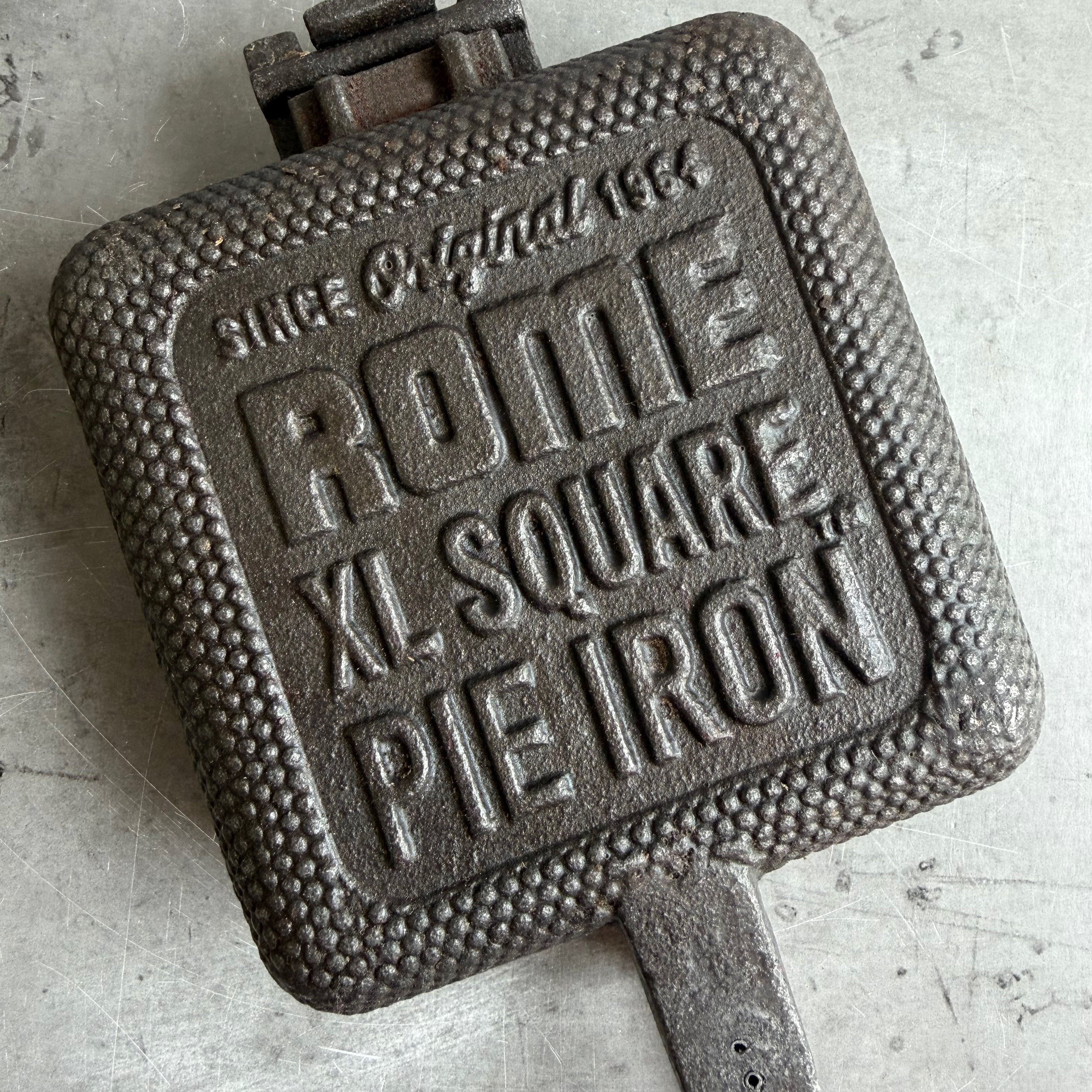 XL Square Pie Iron cooking head close up gray background