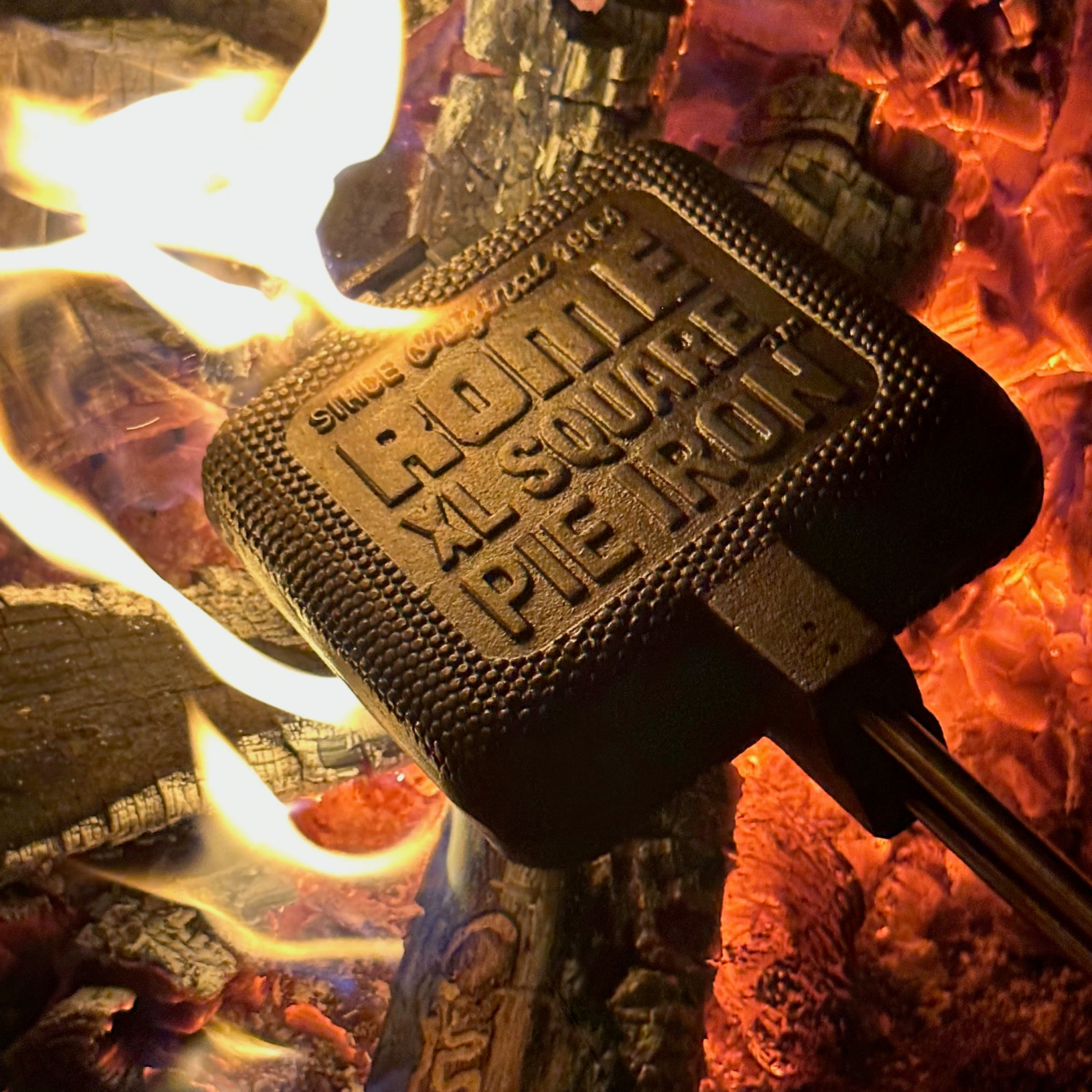 XL Square Pie Iron cooking head in campfire close up view