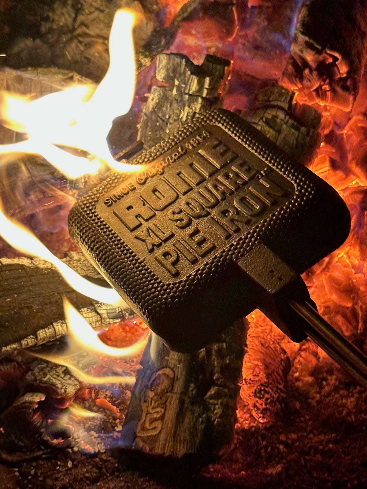 XL Square Pie Iron cooking head in campfire close up view