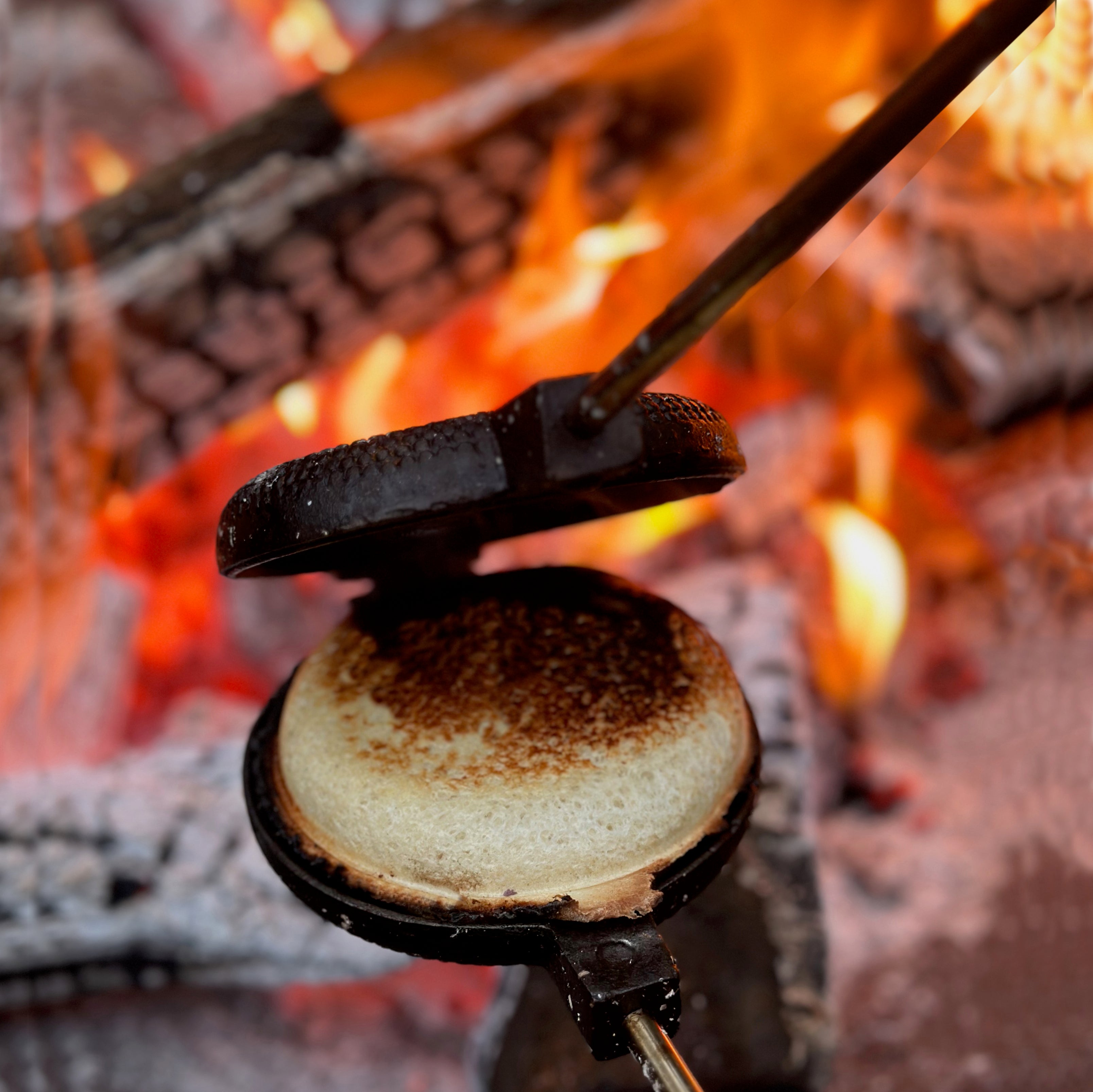 Round Pie Iron in use open in campfire