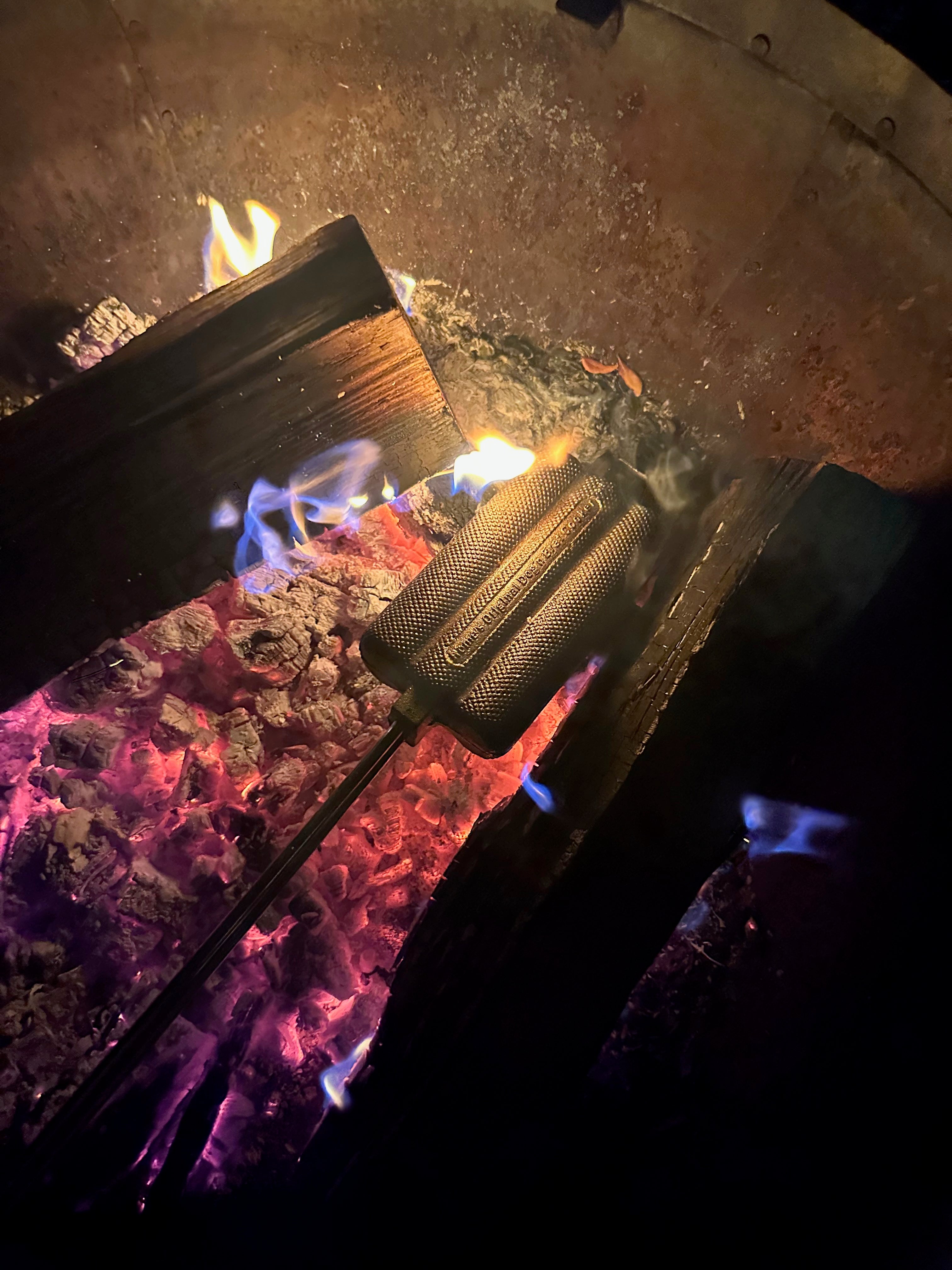 Dong N Brat Cooker in use in fire pit