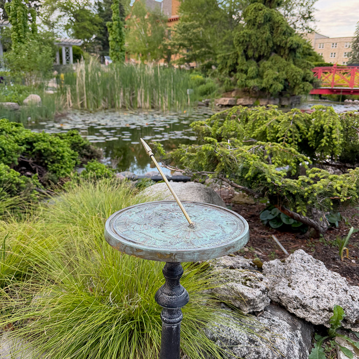 Solid Brass Flowers Sundial on pedestal in garden
