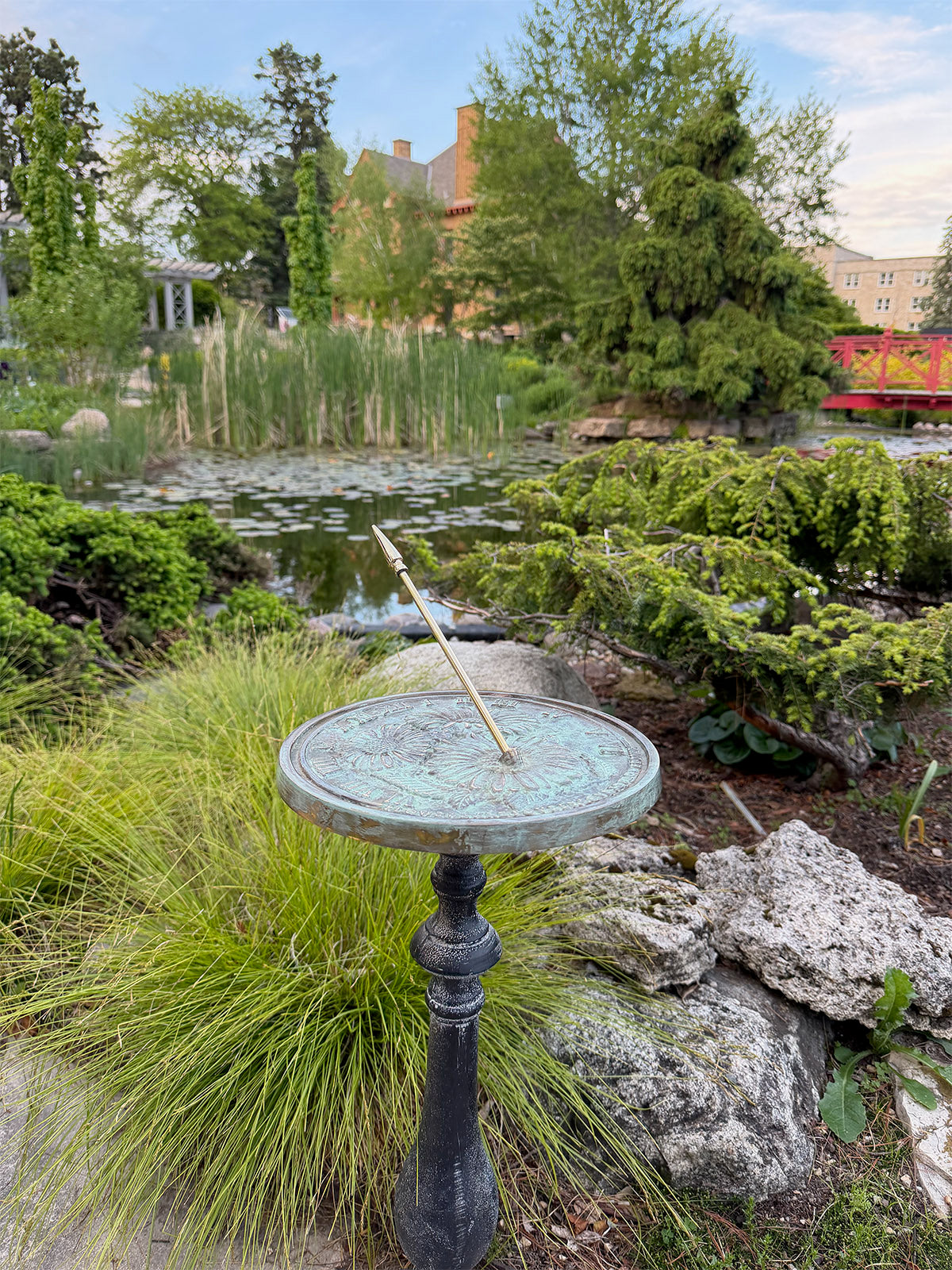 Solid Brass Flowers Sundial on pedestal in garden