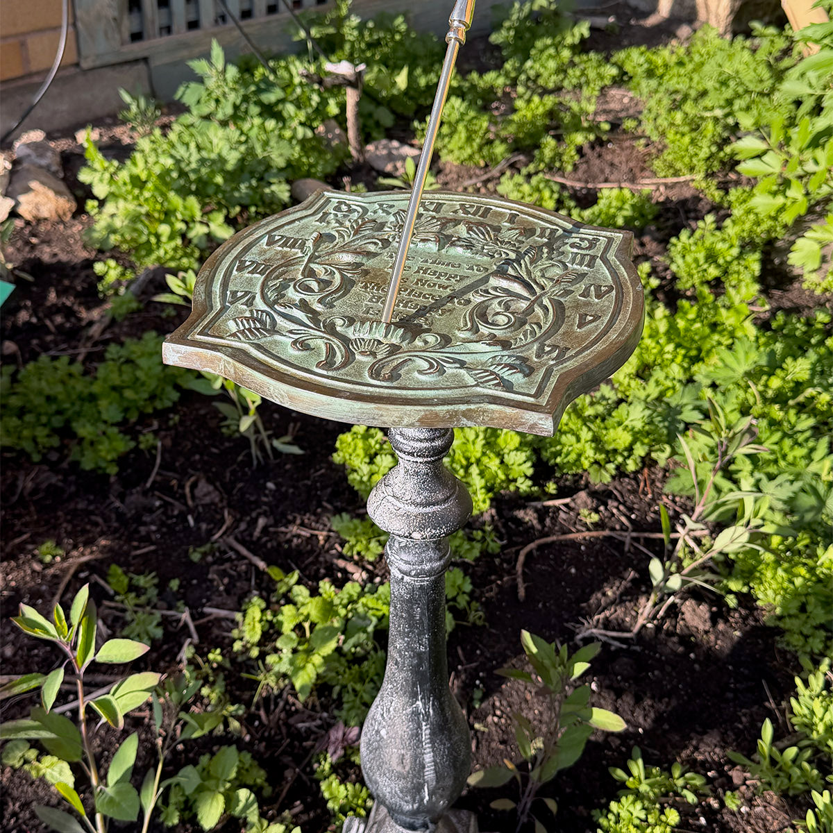 Solid Brass Happiness Sundial on pedestal in garden full view