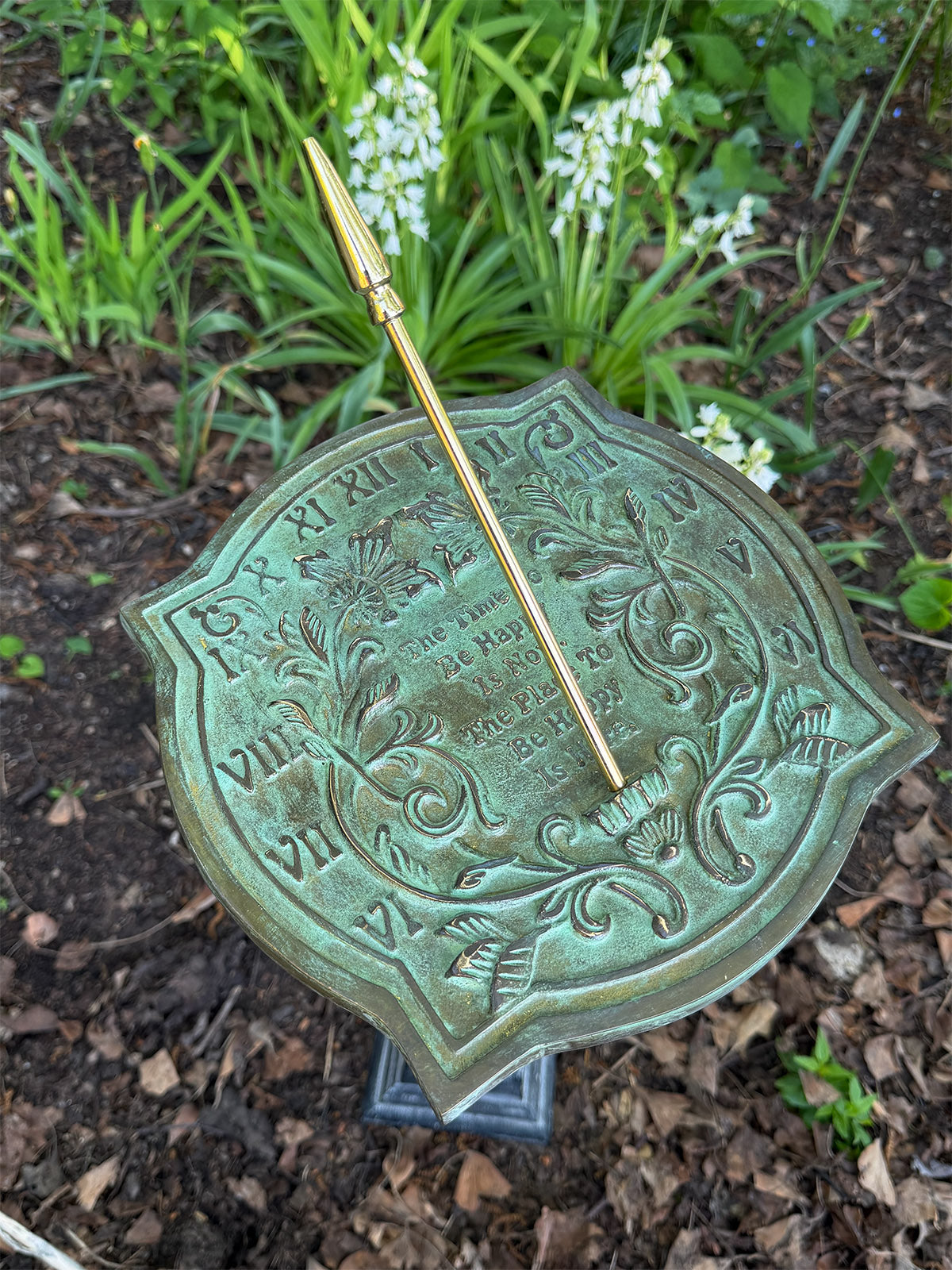Solid Brass Happiness Sundial in garden top view
