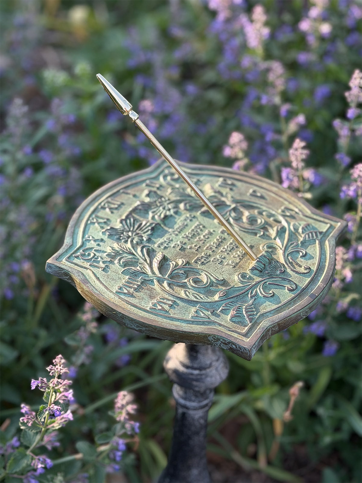 Solid Brass Happiness Sundial on pedestal in garden top view