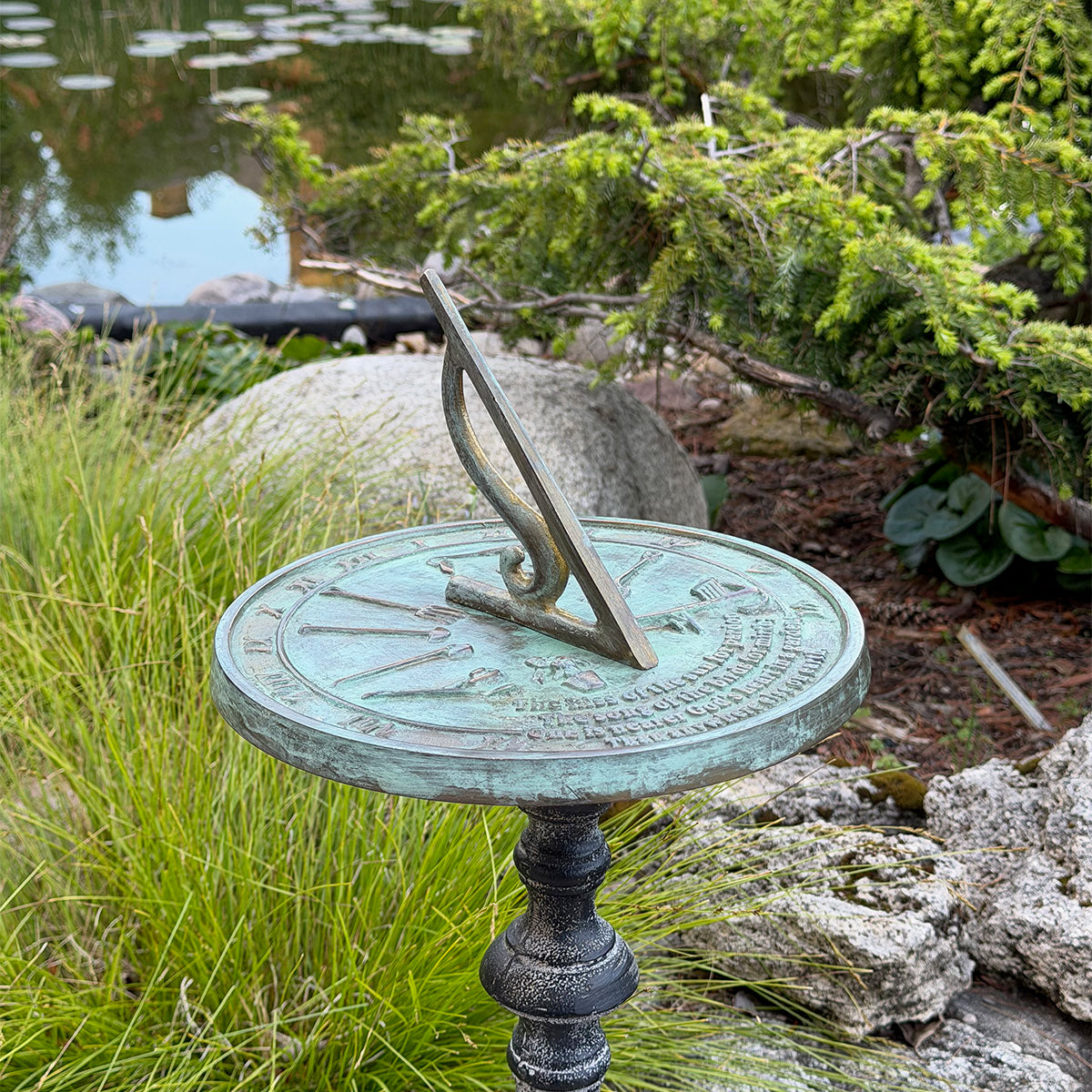 Solid Brass Kiss Of The Sun Sundial on pedestal in garden b