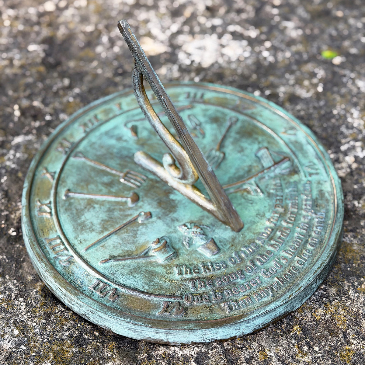 Solid Brass Kiss Of The Sun Sundial in garden top view b